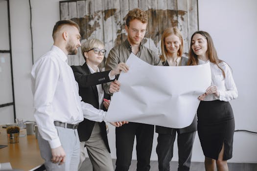 People Looking at a Paper at the Office